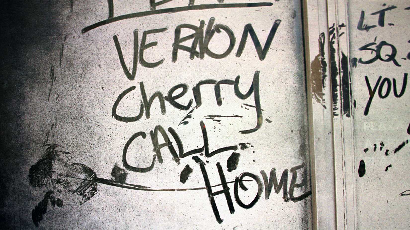 The words “Vernon Cherry call home” are written through dust on a window near Ground Zero.