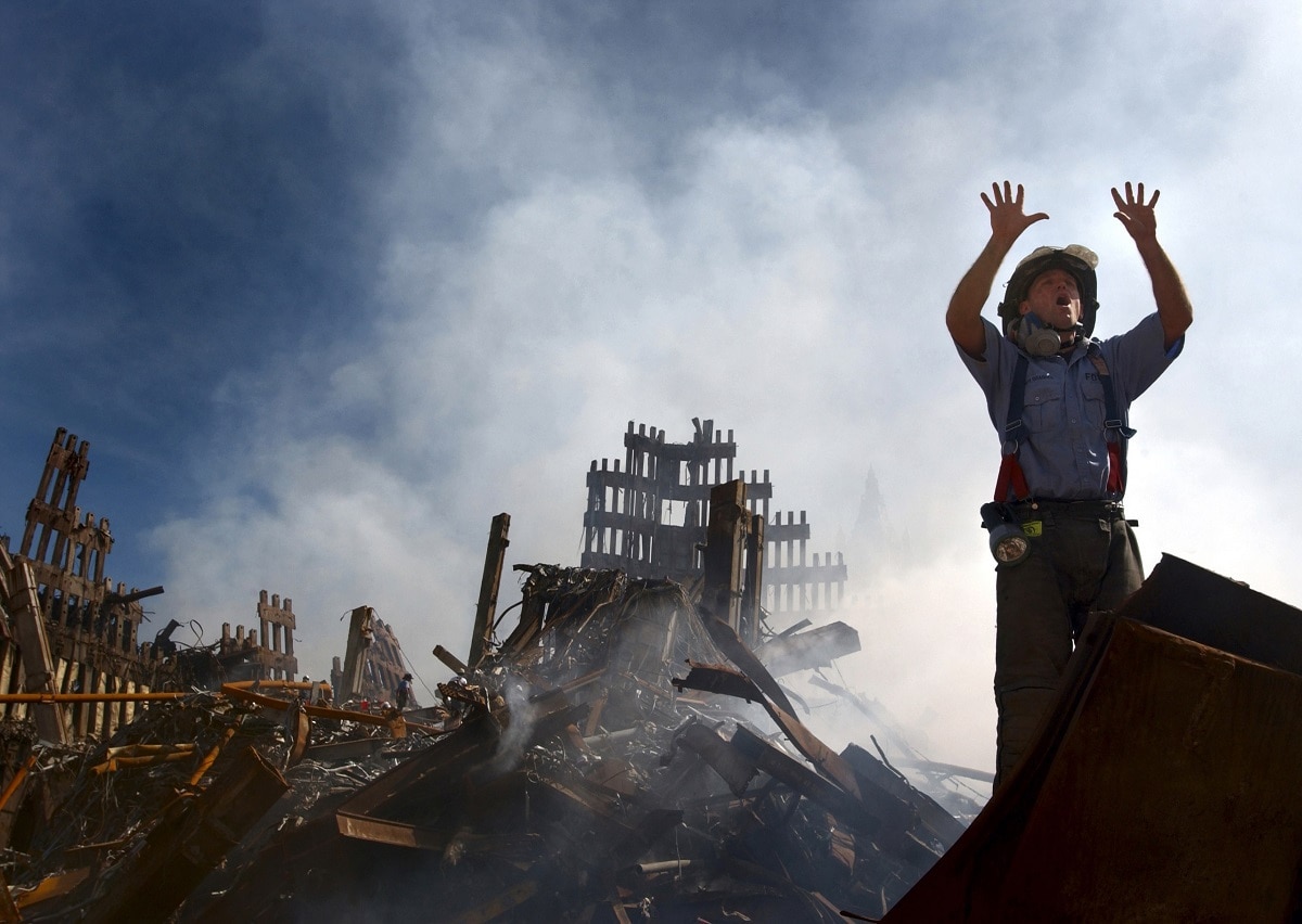 010915-N-3995K-015.New York, N.Y. (Sept. 15, 2001) -- A New York City fireman calls for 10 more rescue workers to make their way into the rubble of the World Trade Center. U.S. Navy Photo by Journalist 1st Class Preston Keres. (RELEASED)
