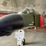 A Fully Loaded with Bombs US Air Force F-4 Phantom Fighter Rolled Upside Down Underneath a Tanker at Night in a Thunderstorm To Get Separation