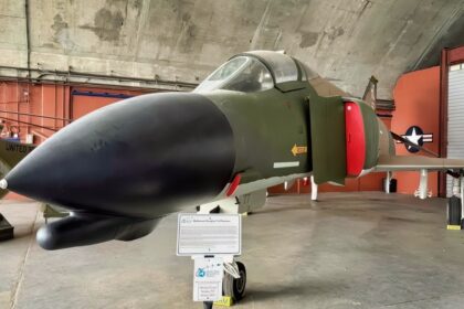 A Fully Loaded with Bombs US Air Force F-4 Phantom Fighter Rolled Upside Down Underneath a Tanker at Night in a Thunderstorm To Get Separation