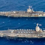 The US Navy Planned to Deliver the Aircraft Carrier USS John F. Kennedy in July 2025. She Is Now Due in March 2027. The 20-Month Slip Came Down to Arresting Gear Certification and the Weapons Elevators — the Same 2 Systems That Held Up USS Gerald R. Ford.