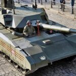 A tank with an unmanned turret and an armored crew capsule was shown off in 2015, kept out of its own country’s war because cheap drones might kill it, and is now being redrawn around a 152mm gun with 40 rounds, 24 in the autoloader, and a drone on a tether