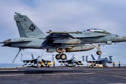 USS Abraham Lincoln is 305 days into a cruise that is now the second-longest U.S. aircraft carrier deployment since the Cold War and after Iran combat, 208 days straight at sea, and a one-day stop at Naval Base Guam the strike group is still weeks from San Diego