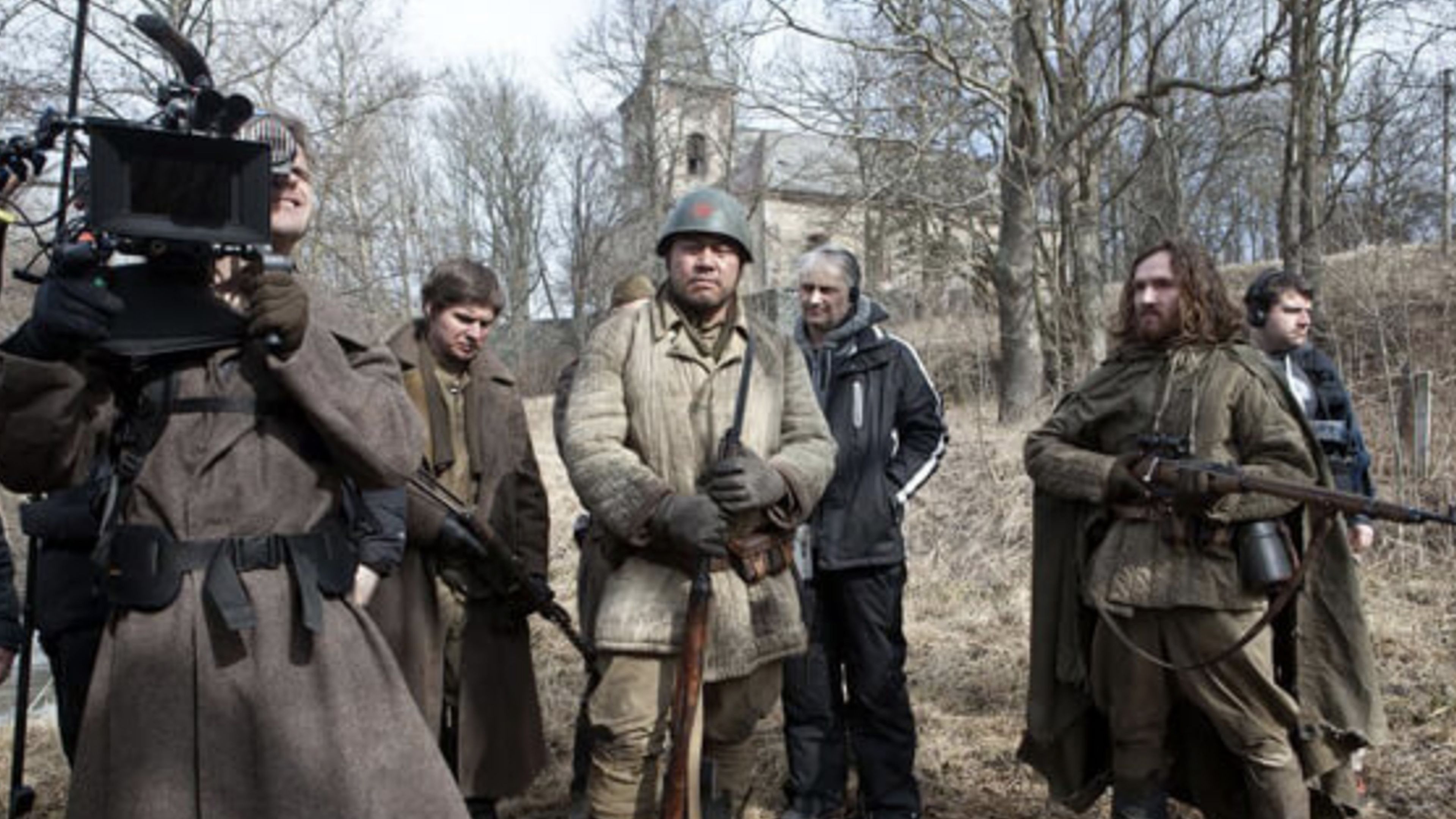 Actors dressed as World War II Soviet soldiers stand with a camera crew during production of Frankenstein’s Army.