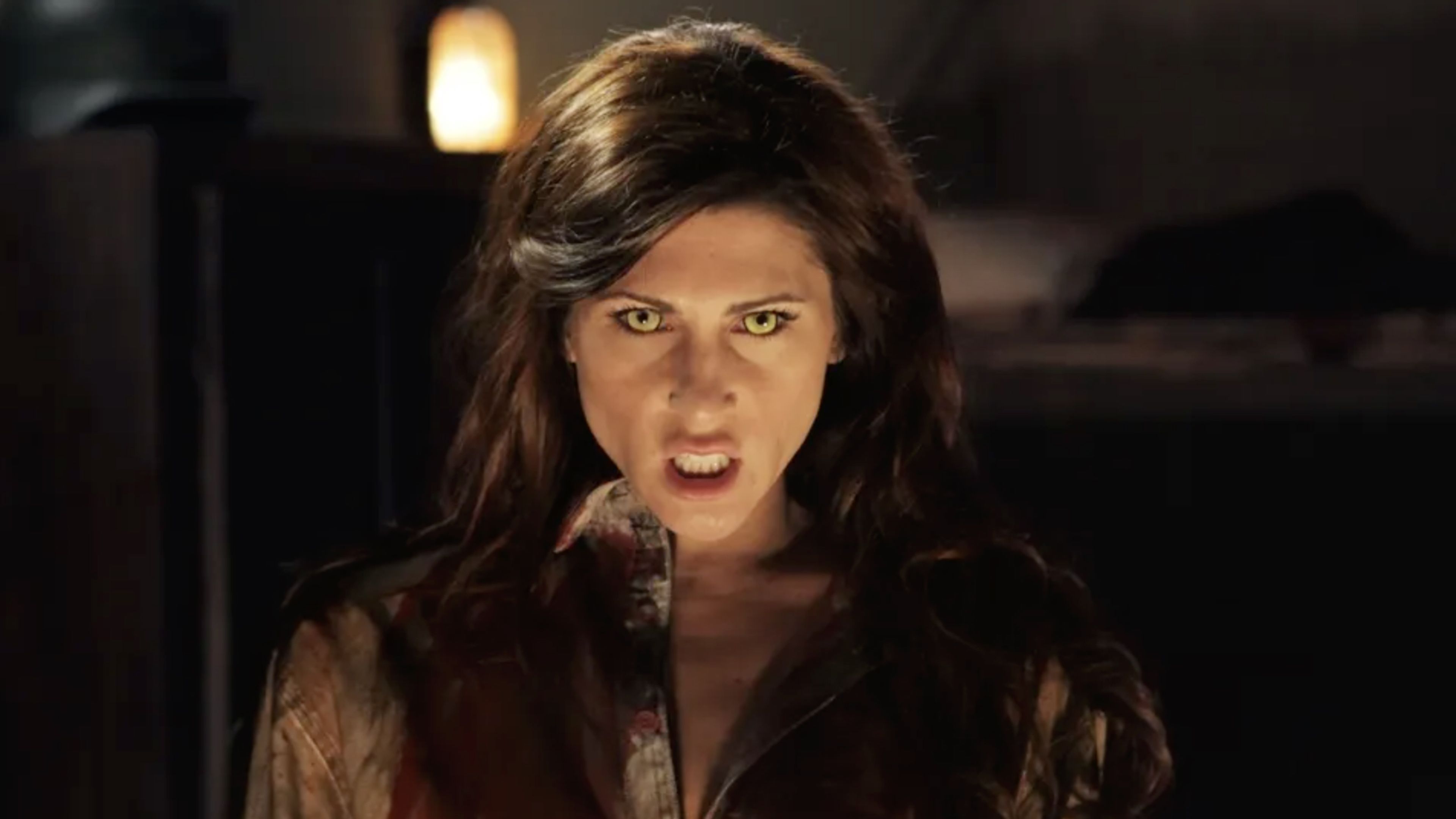 A woman with glowing yellow eyes appears as a supernatural demon in the World War II horror movie The Devil’s Rock.